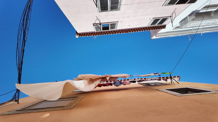 Hanging clothes on the roof of the house.の写真素材