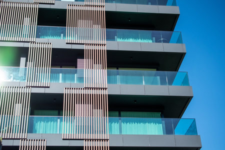 Modern apartment buildings on a sunny day with a blue sky. Facade of a modern apartment building
