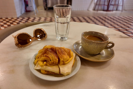 Coffee and croissants on a table in a cafe
