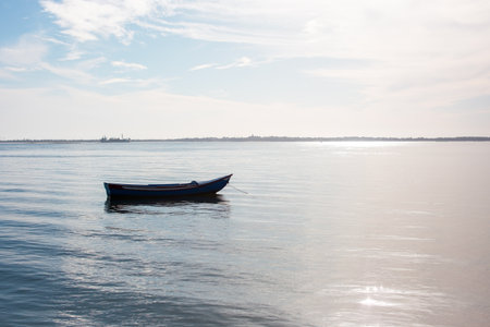 Boat in the sea on a sunny day with blue skyの写真素材