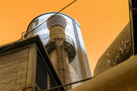 Industrial water tower in the city, close-up of photoの写真素材