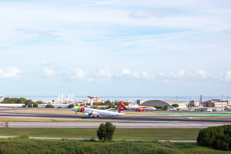 Plane taxiing on runway of Lisbon airportのeditorial素材