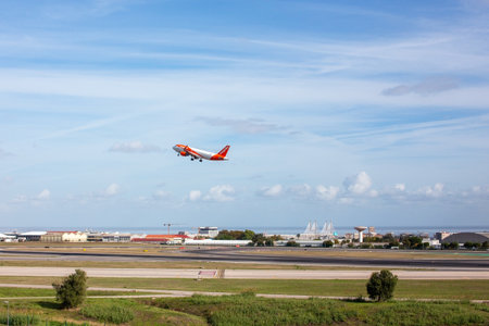 Airplane taking off from the runway of Lisbon Airportのeditorial素材