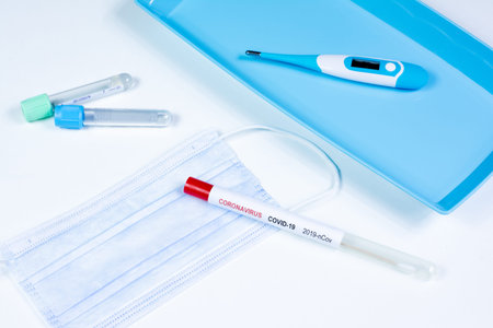 Medical thermometer, mask, two blood collection tubes and swab