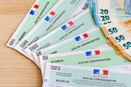 Notice of traffic tickets for violations of the Highway Code, in France. And Euro banknotesのeditorial素材