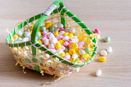 Easter. Basket filled with small sugar eggs