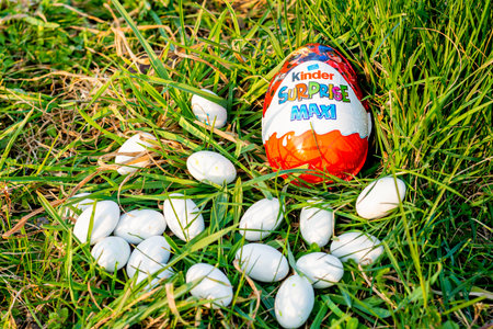 Kinder Maxi surprise and Easter eggs on the grass
