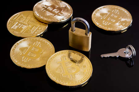 Bitcoins coins and closed padlock. Secure your cryptocurrenciesの写真素材