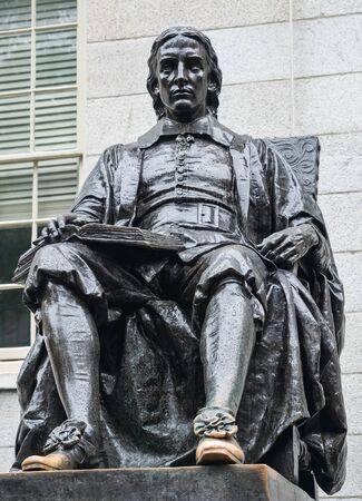 Cambridge, Massachusetts, USA, September 25, 2018. Harvard University, sculpture of John Harvard, in the center of Harvard Yard, the oldest area of the campus.のeditorial素材