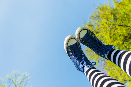 Sneakers on the sky background. Rest conceptの写真素材