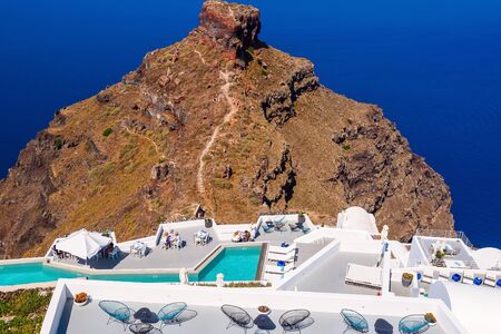 Terrace with pool on Santorini with sea view. Amazing luxury resort. Cyclades, Greece.の写真素材