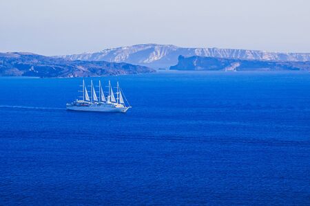 beautiful white sailing ship in aegean sea, Santorini, Greeceの写真素材