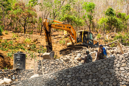 BALI, INDONESIA - December 01, 2019: Balinese construction workers preparation for building work to...