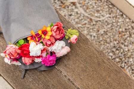 Backpack with different flowers. Spring summer conceptの写真素材