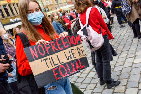 Wroclaw, Poland, 06.06.2020 - Young people hold a poster with words "no freedom till we`re equal" on polish peaceful protest against racism and hatred in Wroclaw city.のeditorial素材