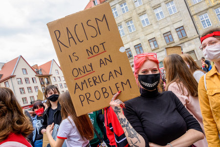 Wroclaw, Poland, 06/06/2020 - Young people hold a poster with words
