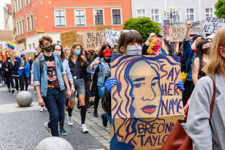 Wroclaw, Poland, 06.06.2020 - Young people hold a poster with police victims names from on polish peaceful protest against racism and hatred in Wroclaw city. Black lives matterのeditorial素材