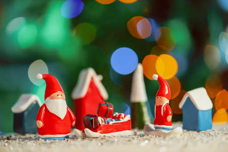 christmas greeting card. Santa Claus arrives presents on blurred backgroundの写真素材