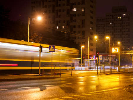 public transport driving at night city streetの写真素材