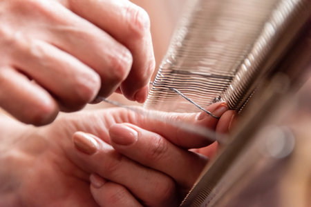 Womans hands working with knitting machine, knitting as womans hobbies. Small Business of Garment...