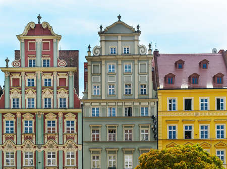colorful buildings in european city, multicolor houses facades on market squareの写真素材
