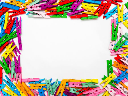 frame from multi colored wooden decorative clothespins, horizontal photo with place for text on...