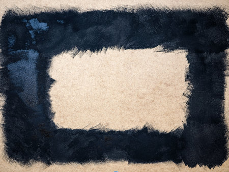 black hand painting frame on wooden board, background surfaceの写真素材