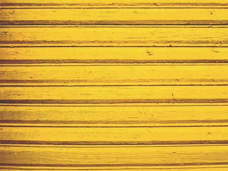 Old wooden planks painted in yellow colorsの写真素材