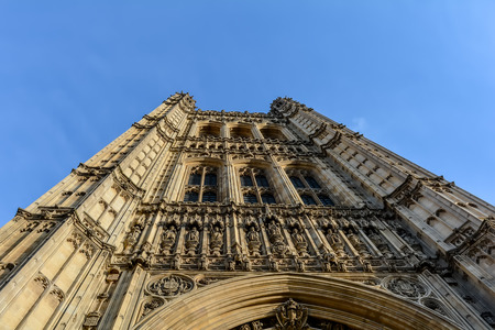 A view of the neo-Gothic Victoria Tower of the Palace of Westminster from low angle against the blue skyのeditorial素材
