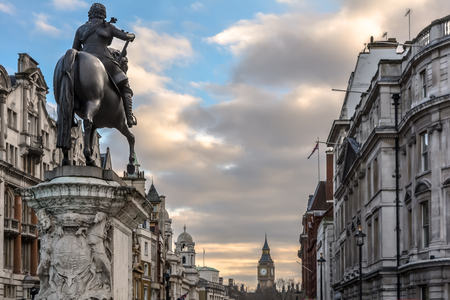 View from Trafalgar Square on the back of the Renaissance-style equestrian statue of Charles I on horseback looking down Whitehall towards Big Ben, Westminster, London.のeditorial素材
