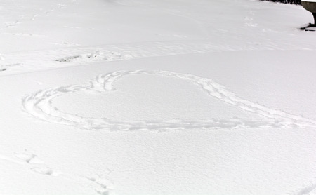 The shape of heart on the snowの写真素材