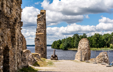 Ruins and cannon of Koknese Castle over the waters of two rivers - Daugava and Perse. It was one of the largest and most significant medieval castles on Latvian territory, now partially submerged.の写真素材