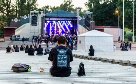 Jekabpils, Latvia - August 3, 2018: Heavy metal fans looking at stage during Latvian death-doom metal band Frailty performance at Metalshow Open Air festival in Latvia.のeditorial素材