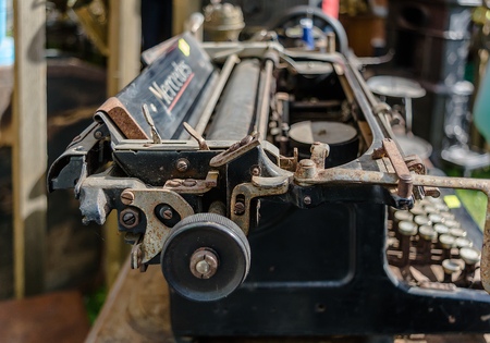Daugavpils, Latvia - July 15 2017: Old rusty vintage Mercedes typewriter closeup shot in flea market. Manufactured by Mercedes Buromaschinen-Werke and had no connection with famous car manufacturer.のeditorial素材