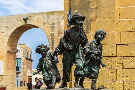 Valletta, Malta - August 30, 2019: Replica of the statue Les Gavroches (Street boys), which represents three poor street children roaming streets of Paris during tumultuous days of the 1848 revolutionのeditorial素材