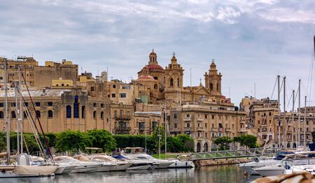 Cospicua, Malta - September 1, 2019: Cospicua and the Church of the Immaculate Conception, Malta. The church towering above Bormla.のeditorial素材