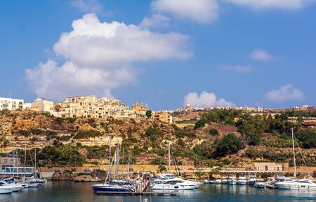 Mgarr, Gozo, Malta - September 3, 2019: Yachts and boats anchored in yacht marina in Mgarr harbour, at Gozo island, Malta.のeditorial素材