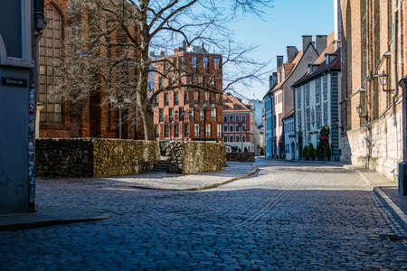 Riga, Latvia - April 5, 2020: Empty medieval Old Town's streets in Coronavirus quarantine period. City center in coronavirus COVID-19 pandemic quarantine time.のeditorial素材
