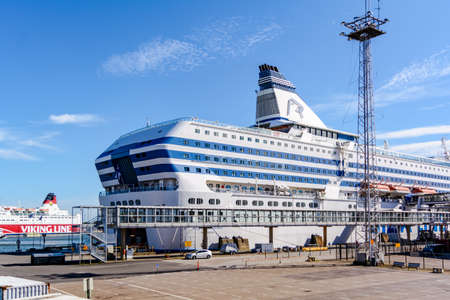 Helsinki, Finland - August 23, 2020: Big white and blue Silja Serenade cruise ship moored at Olympia Terminal in the Port of Helsinki.のeditorial素材
