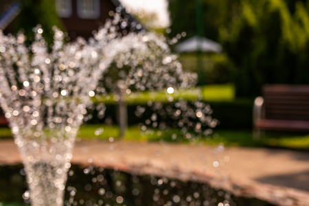 Unfocused fountain near the old house in Nida.の写真素材
