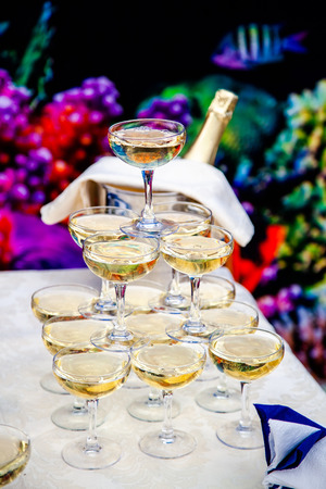 Champagne glasses standing in a tower at the party.の写真素材