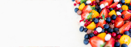 Close up. Creamy mascarpone cheese cake with strawberry and winter berries. New York Cheesecake. Close up. Christmas dessert. Healthy food Copyspasy for text, addの写真素材