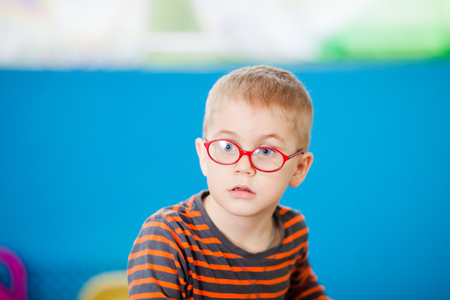 Surprised five years old boy wearing glasses.の写真素材