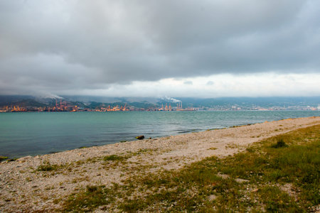 Stormy clouds under the Black sea. Themes bay in Novorossiysk in Krasnodar region, Russia. Image of sea trading port.の写真素材