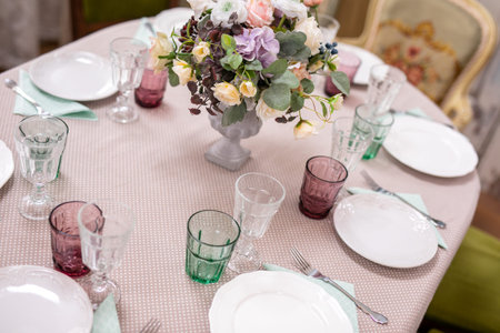 bouquet of flowers in a vase at the wedding table.