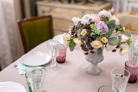 bouquet of flowers in a vase at the wedding table.の写真素材