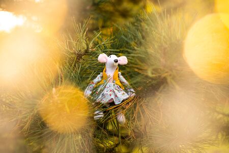 Little mouses toy, symbol of Chinese happy new 2020 in blue dress and new year decoration. Horoscope sign 2020. New Year 's 2020 Symbol. Greeting Christmas card. Front view. Selective focus.の写真素材