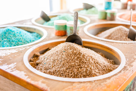 Dead Sea colorful salt and scoop on a buckets at a souvenir shop in Kalia Beach, West Bank