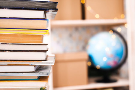 various old books on a shelf on dark background, banner.の写真素材