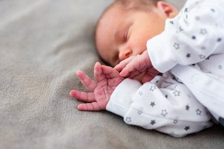Baby boy sleeping first days of life. Cute little newborn child sleeping peacefully.の写真素材